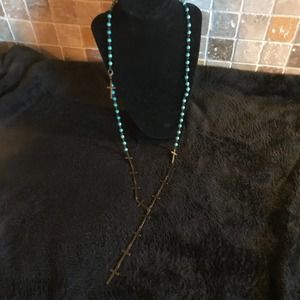 Long brass and turquoise colored beaded necklace